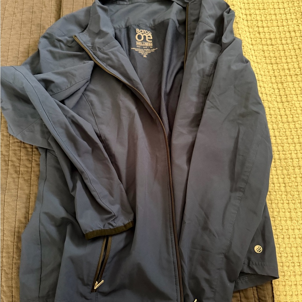 Blue barco scrub jacket with black trimming